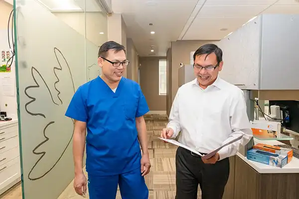  Two of our doctors in the hallway at Picasso Dental Care