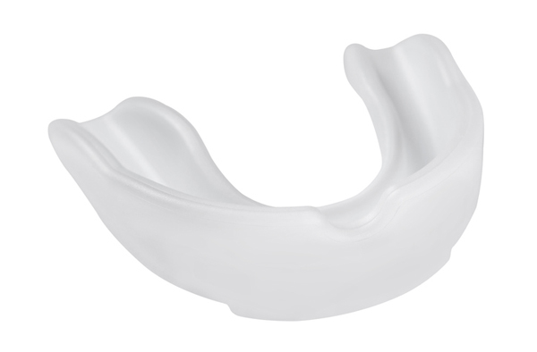 Opaque white plastic mouth guard on a white background